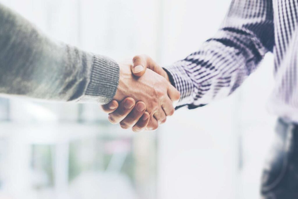 Two Businessmen Shake Hands