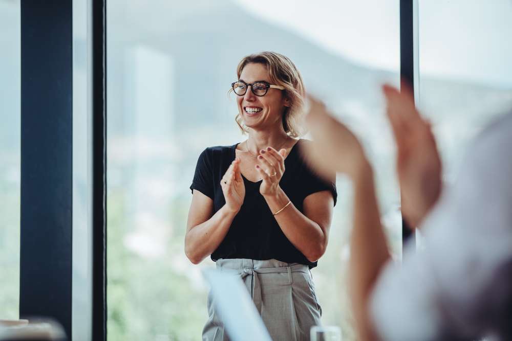 Satisfied Employee At Team Meeting