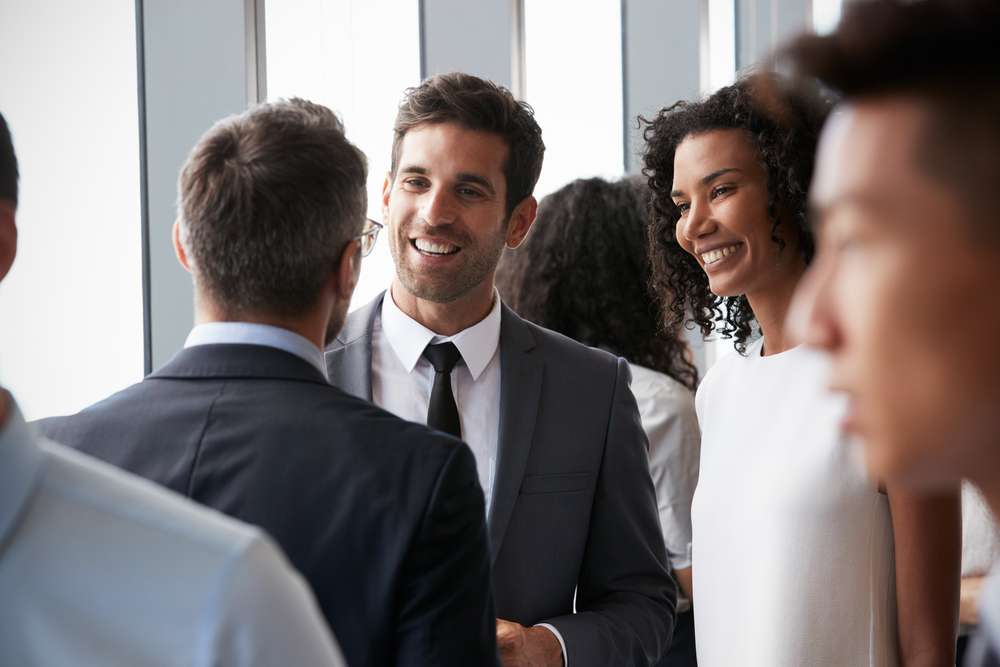 Group Of Business People Having Informal Office Meeting