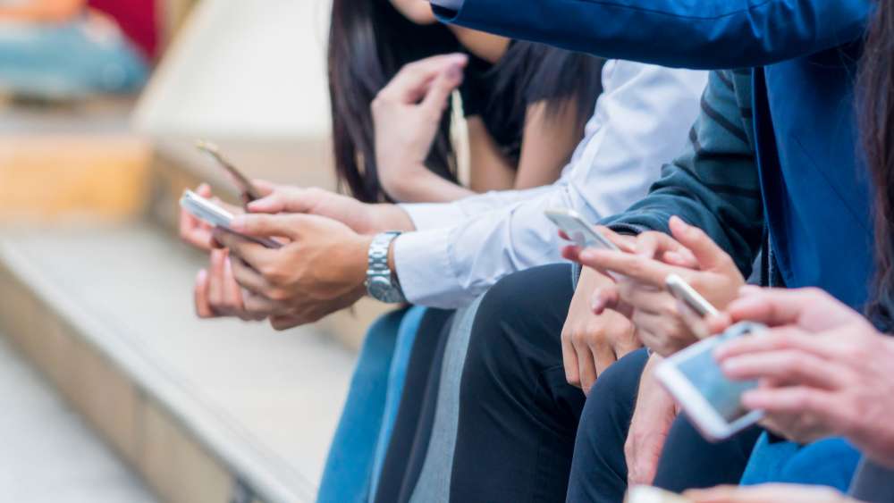 Group of professionals on smart phones