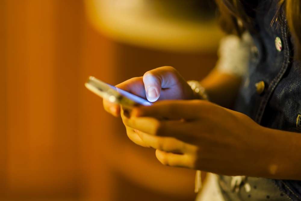 Woman using social media on her smartphone